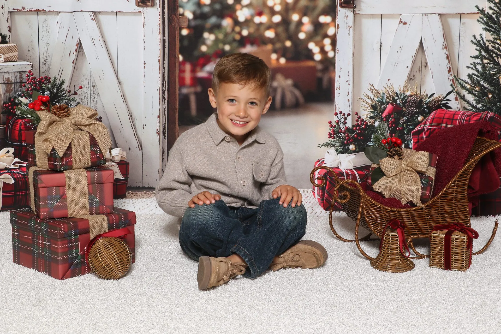 A nursery child photographed in a Christmas set