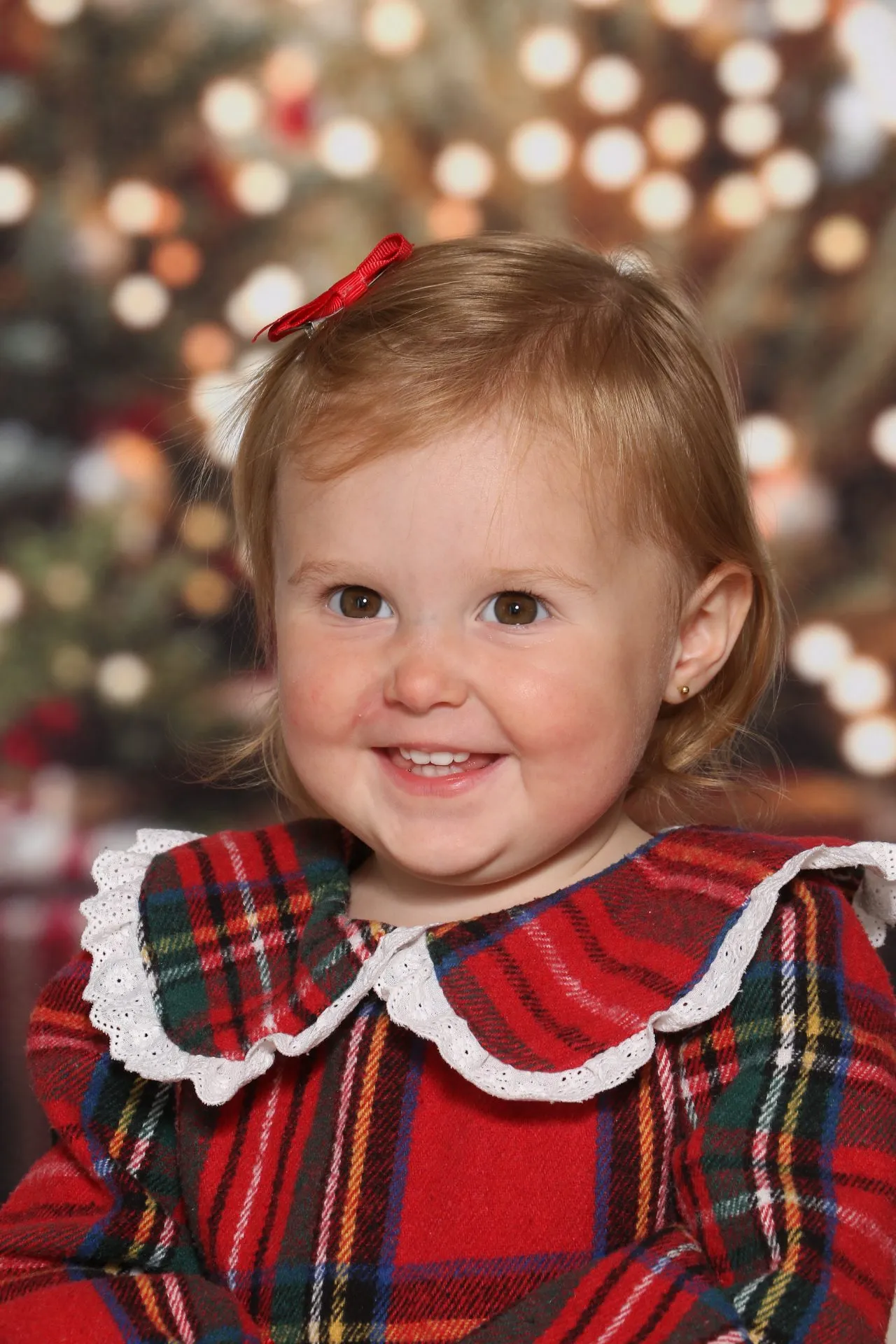 Close up of child with christmas lights